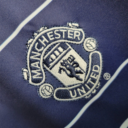 MNU 99-00 Away Shirt badge