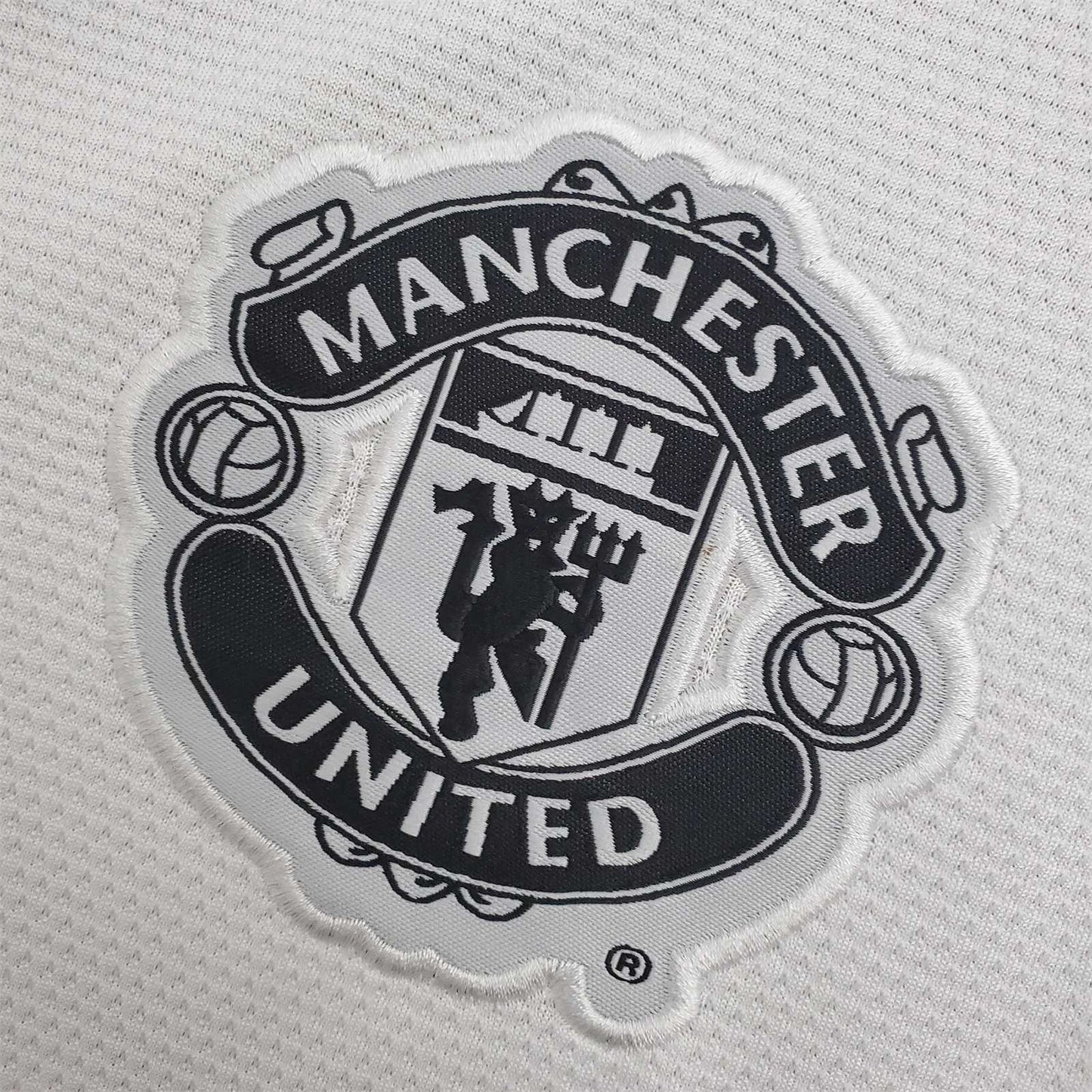 MNU 13-14 3rd Shirt badge